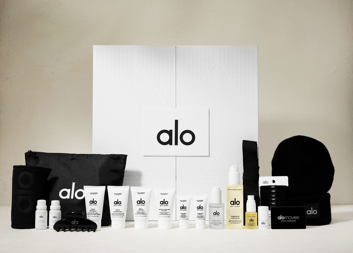 Shot of a closed Alo advent calendar box with products lined up in front.